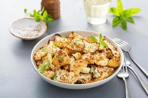 Roasted cauliflower with fresh herbs and spices photo