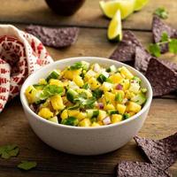 Pineapple and cucumber salsa with jalapeno and red onion photo