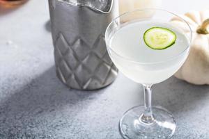 Fall cocktails, gin cocktail with a slice of cucumber photo