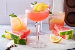 Watermelon and citrus cocktail with lemon garnish photo