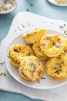 Bacon and cheddar egg muffins for breakfast photo