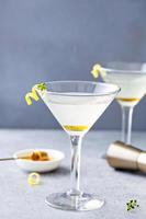 Honey and thyme lemon drop martini with garnish