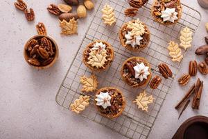 Mini pecan pies baked in a muffin tin photo