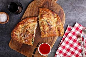 Traditional calzone cut in half photo