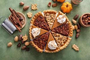 Traditional fall Thanksgiving pie slices, pumpkin and pecan pie photo
