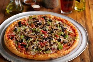 Vegetarian pizza with vegetables and mushrooms photo