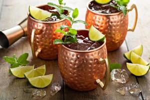 Traditional Moscow Mule in classic copper mugs photo