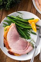 Christmas honey glazed ham served on a plate photo