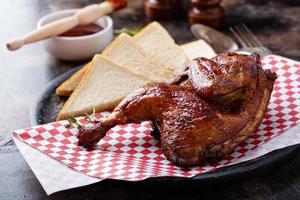 Smoked chicken half with toast photo