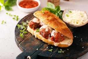 Meatball sub sandwich with marinara and mozzarella photo