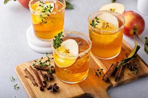 Hard apple cider cocktail with cinnamon and thyme, fall drink