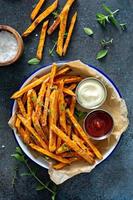 Sweet potato fries with sauces photo