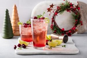 Cranberry and lime cocktail or mocktail for the holiday dinner photo