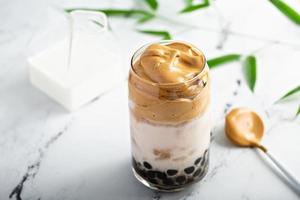 Boba dalgona coffee with tapioca pearls and whipped coffee photo