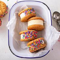 Ice cream and cookies sandwiches stacked on the table photo