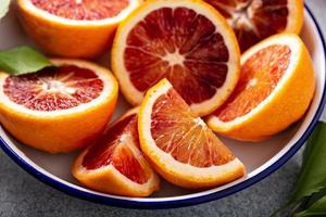 Blood oranges cut into half photo