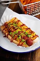 Grilled bacon wrapped hot dog photo