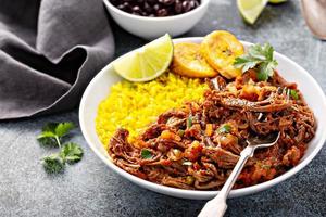 Ropa vieja, flank steak dish with rice photo