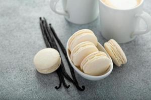 Vanilla macarons in a little bowl photo