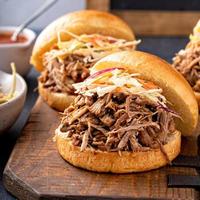 Pulled pork sandwiches with cole slaw on brioche buns photo