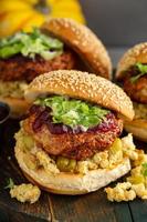 Turkey burgers with stuffing and cranberry sauce photo