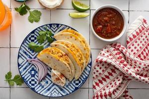 Baked tacos with pulled chicken and cheese photo