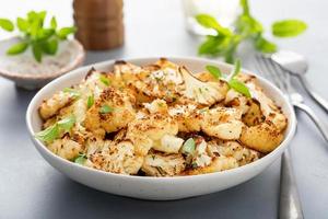 Roasted cauliflower with fresh herbs and spices photo