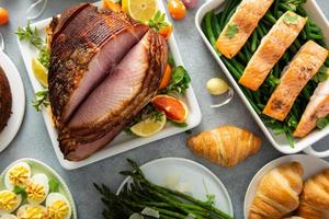 Easter brunch with spiral cut ham and roasted salmon photo