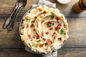 Bacon mashed potatoes with cheddar cheese and parsley photo