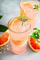 Cold and refreshing summer grapefruit cocktail photo