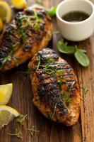 Balsamic grilled chicken breast on a board photo