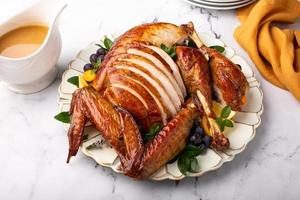 Carved roasted turkey for a celebration dinner photo