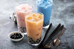 Variety of milk bubble tea in tall glasses photo