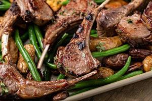 Grilled or roasted lamb chops with green beans and potatoes photo