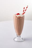 Chocolate milkshake with whipped cream photo