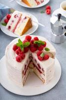 Respberry cake with light mascarpone frosting and fresh berries photo