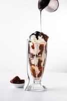 Chocolate ice cream sundae with whipped cream photo