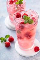 Spring or summer cocktail with raspberry and mint