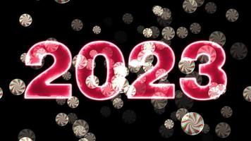 Red text 2023 animation and flying Christmas balls isolated on black background, 2023 new year, design template Happy 2023 New Year concept Holiday animate card video