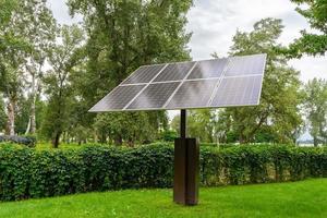 Solar panels in public park, eco friendly, green, renewable energy concept photo
