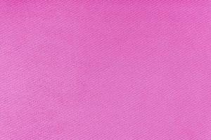 Texture of pink fabric diagonal weave pattern. Decorative textile background photo