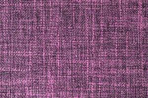 Close up texture of purple coarse weave upholstery fabric. Decorative textile background photo
