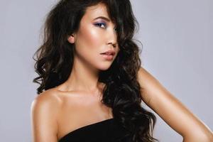 Young asian woman with a beautiful curly hair and make-up photo