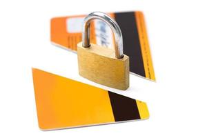 Padlock and broken credit card on white background photo