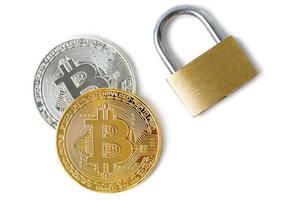 Bitcoin coins and padlock on white background photo