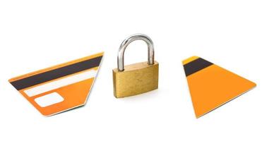 Padlock and broken credit card on white background photo