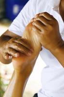 Closeup of female feet during traditional Thai massage photo