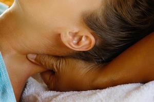 Young caucasian woman during traditional Thai massage photo