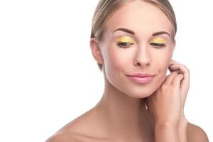 Beautiful blonde girl with bright yellow eyeshadows photo