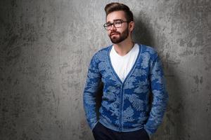 Handsome young bearded man wearing the eyeglasses photo